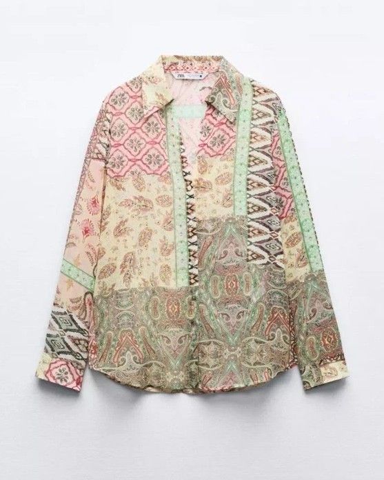 Zara Patchwork Print Long Sleeve Shirt (Category: Tshirts & Polo Shirts ) located in Cordova. Submitted by prelovedceb7 (Listing ID 1453845863, Image 1). Description: - Zara patchwork print shirt - Size: Medium (M) - Long sleeves with button cuffs - Button-up front closure - Lightweight material, ideal for layering - Unique pattern with pink, green, and beige tones - Made in Morocco.