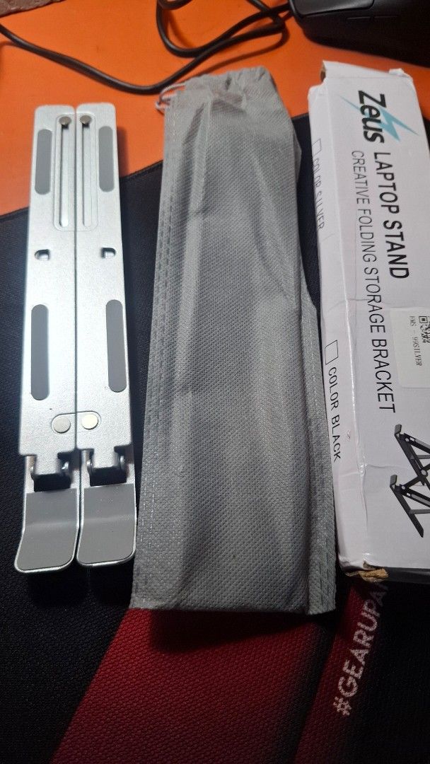 ZEUS Laptop Stand (Category: Laptop Bags & Sleeves) located in Quezon City. Submitted by pj______ (Listing ID 1453951419, Image 3). Description: RFS:too high for my table BRAND NEW WITH BOX AND CASE .