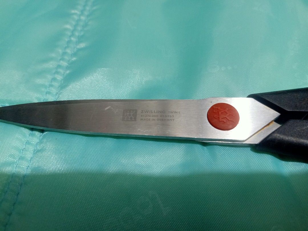 Zwilling Twin L Kitchen Shears Made in Germany (Category: Other Kitchenware & Tableware) located in Pasig City. Submitted by urdal01 (Listing ID 1453947188, Image 1). Description: - Zwilling Twin L Kitchen Shears - Made in Germany - Approximately 8-inch blade length - Comfortable black handles - Ideal for kitchen tasks and general use - Sharp and durable quality.