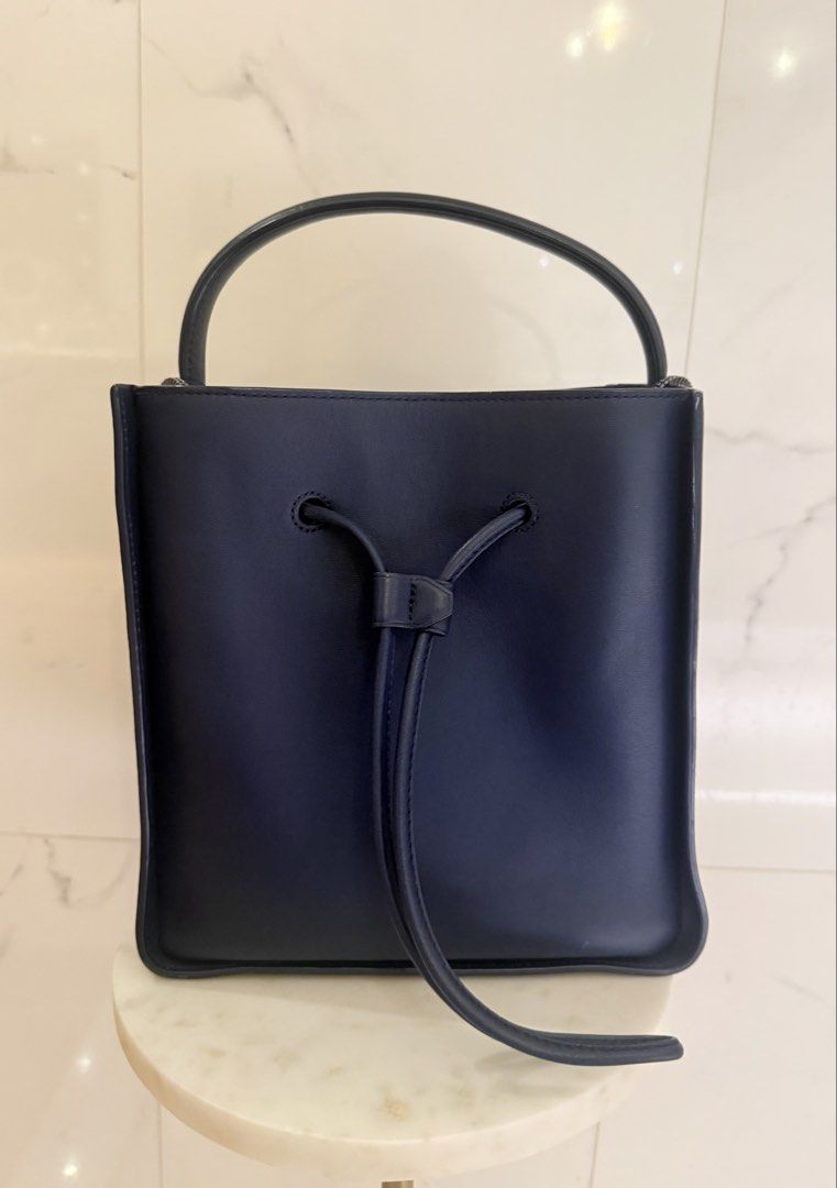 3.1 Philip Lim Bucket bag (Category: Luxury Bags & Wallets) located in Taguig. Submitted by fashionexchangerewear (Listing ID 1454115471, Image 2). Description: Premium quality leather. Bucket bag that doesn’t go out of style. • 3.1 Phillip Lim Bucket Bag • Blue Leather • Silver-Tone Hardware • Canvas Lining • Drawstring Closure at Front • Protective Feet at Base Comes with attached small purse & dust bag Handle Drop: 3.5” Height: 9.5” Width: 6” 