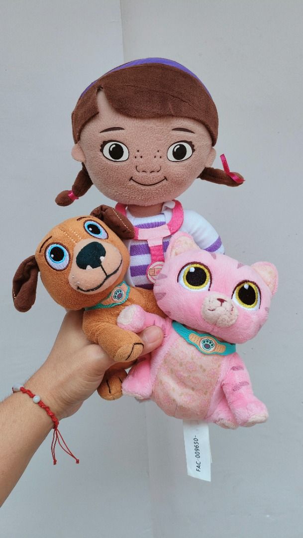 [3] Disney Junior Doc McStuffins Pet Vet plush set (Category: Plushies & Soft Toys) located in Taguig. Submitted by adopt.my.plush.ph (Listing ID 1454090957, Image 1). Description: Disney Junior Doc McStuffins plush toys, including Doc herself along with her pet vet animal friends Findo the dog and Whispers the pink cat. Dottie with her signature purple headband, pigtails, and toy stethoscope. *as is, WYSIWYG ‼️Photos have been uploaded for your 