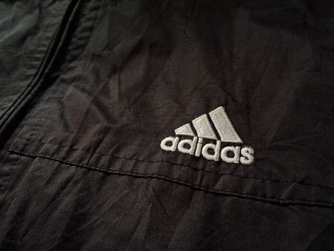 Adidas Black Track Jacket with 3 Stripes (Category: Coats, Jackets and Outerwear) located in Cavite. Submitted by eks1999 (Listing ID 1454057386, Image 2). Description: - Classic black Adidas jacket - Iconic 3 stripes on sleeves - Zippered pockets for essentials - Perfect for sports or casual wear - Lightweight and comfortable - Great for layering.