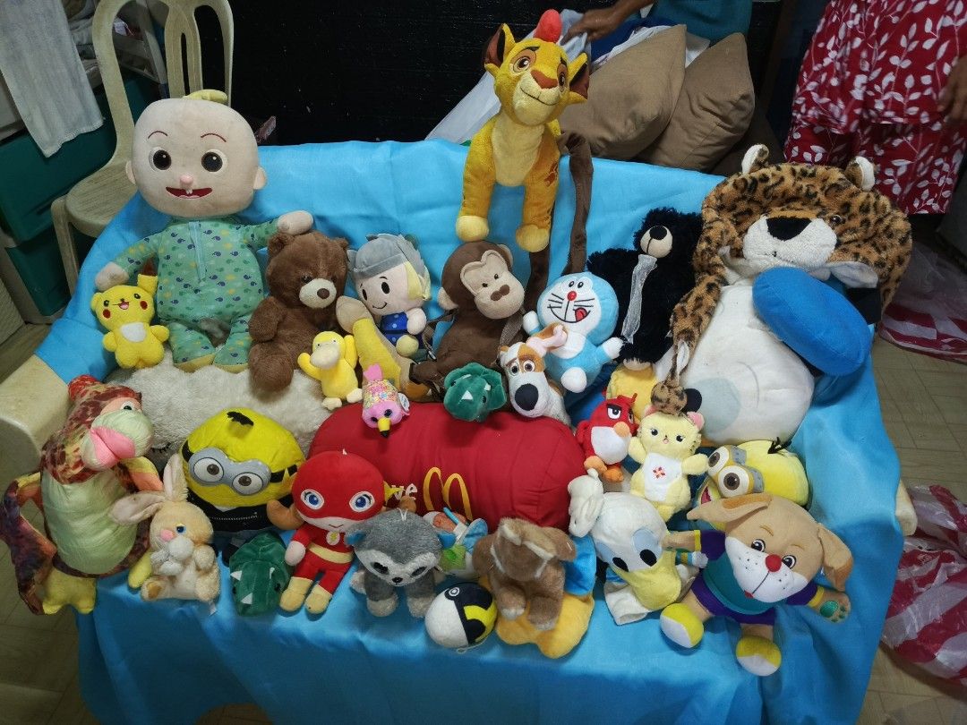 Assorted Plush Toys - Cocomelon, Minions, Doraemon, and more! (Category: Plushies & Soft Toys) located in Manila. Submitted by jullieanne_23 (Listing ID 1454020805, Image 1). Description: - Assorted plush toys available - Featuring popular characters: Cocomelon, Minions, Doraemon, The Lion King - Includes classic teddy bears, a leopard, and other cute stuffed animals - Perfect for children's gifts or collector's items - Some plush toys are large 