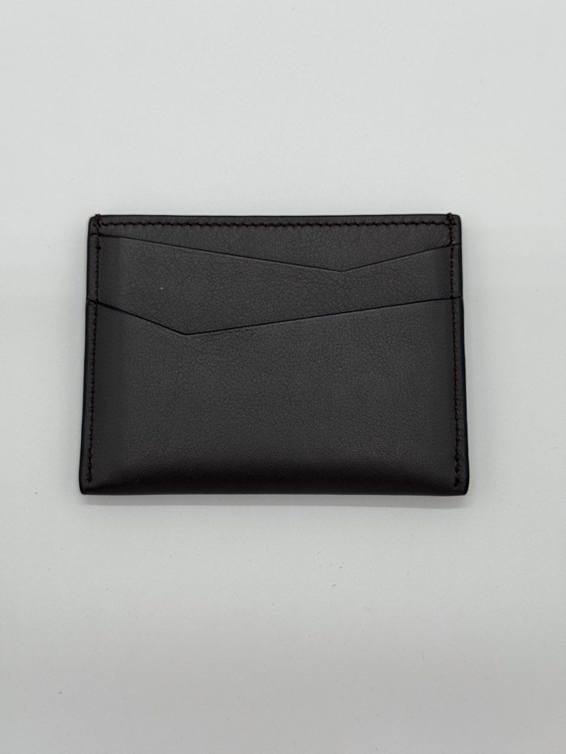 Authentic Loewe Puzzle Cardholder in Dark Grey (Category: Luxury Bags & Wallets) located in Mandaluyong City. Submitted by primecollections.ph (Listing ID 1454038333, Image 3). Description: Loewe Puzzle Cardholder Guaranteed authentic. Money back if proven fake. Selling for 18,000 only. Slightly nego. Condition: 9.2-9.5/10 | Very good condition Directly bought from the store in Marina Bay, Singapore. Barely used, only creases from the cards. Plea
