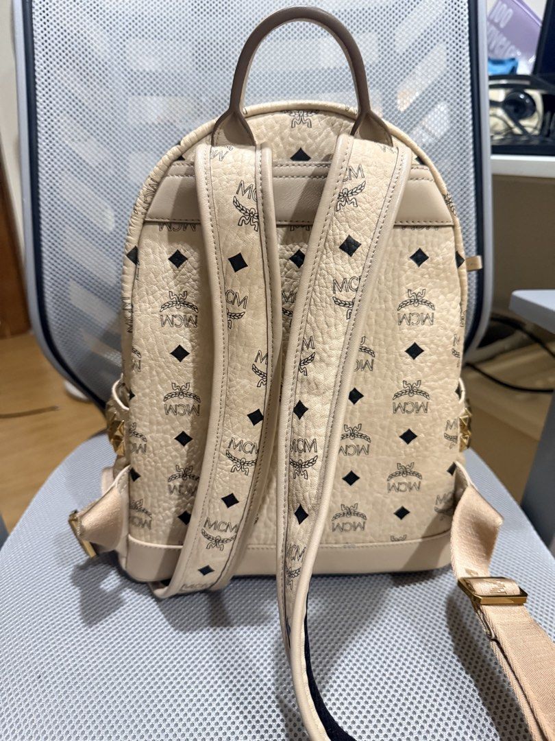 Authentic M C M small bagpack (Category: Luxury Bags & Wallets) located in Manila. Submitted by prettythrift07 (Listing ID 1454018333, Image 3). Description: M C M stark side studs bagpack in visetos beige Exterior minimal signs of usage pero ganda pa nya outside!! Flaws — interior see pics!! Authentic; money back if proven fake Slightly nego for sure buyer :) .
