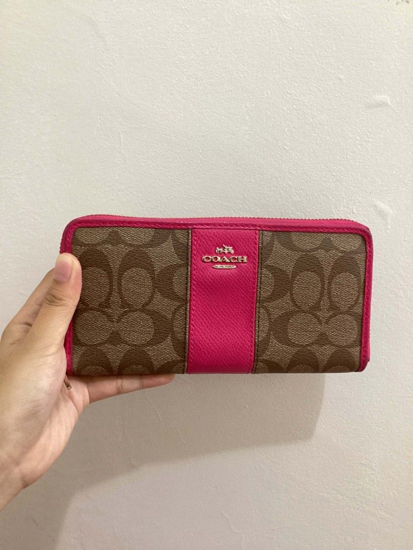 Authentic Pink & Brown Coach Leather Wallet (Category: Luxury Bags & Wallets) located in Batangas. Submitted by snpfinds. (Listing ID 1454046925, Image 1). Description: - Original coach signature accordion wallet - Minor dents/signs of usage only.