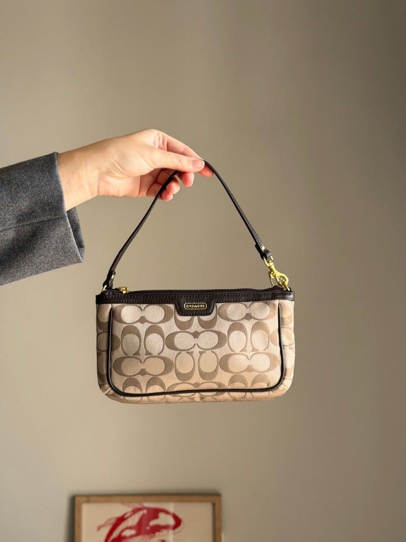 authentic vintage beige brown Coach mini bag (Category: Luxury Bags & Wallets) located in Bulacan. Submitted by angel.decluttersx (Listing ID 1454139240, Image 1). Description: brand new not pre-loved never been used, collection lang sa bahay colour: beige, brown. materials: canvas, genuine leather, gold-tone hardware no issue; in excellent vintage condition dimes: 24 x 14 cm can provide video.