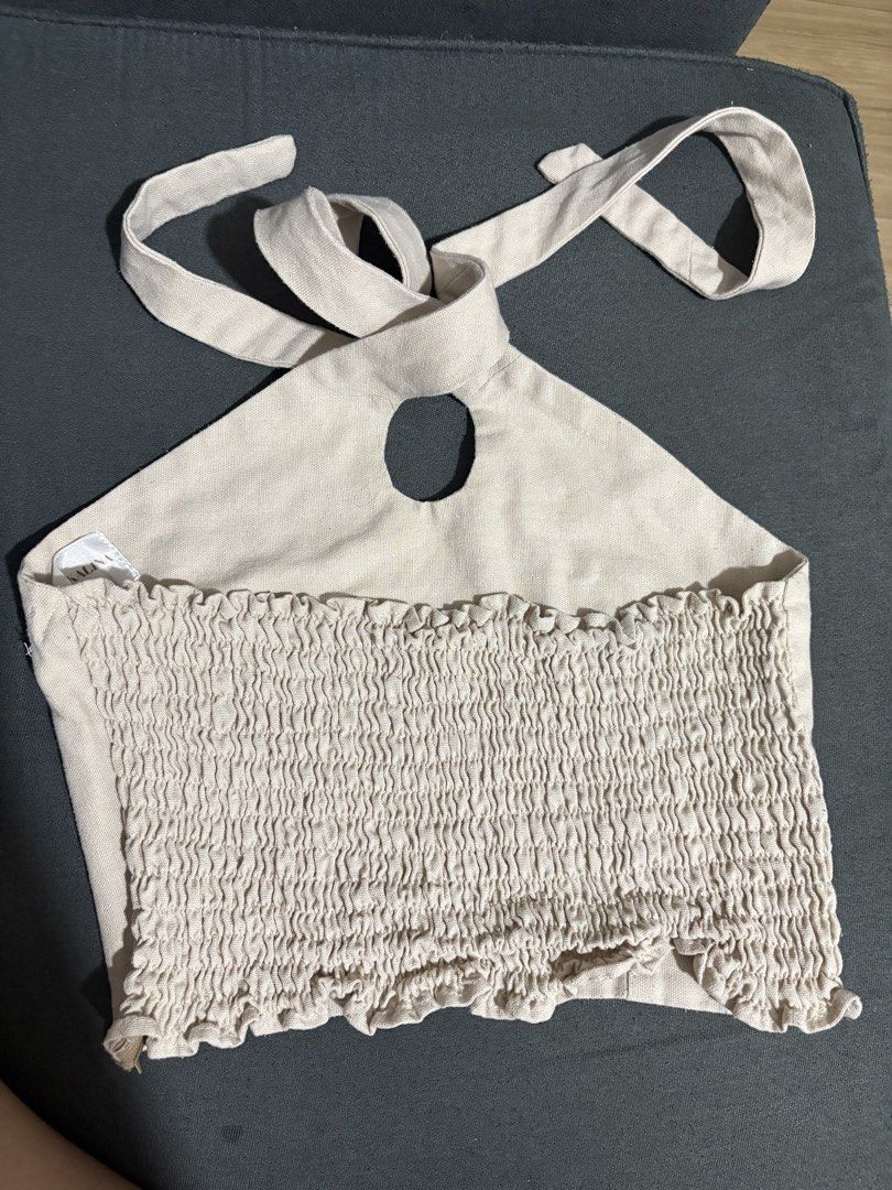 Bacoleña x Kalina Linen HalterTop (Category: Sleeveless) located in Las Pinas. Submitted by flrmz (Listing ID 1454154657, Image 2). Description: - Top from Bacoleña X Kalina collection - Smocked/ruched detail at the back - Beige Rfs: don’t like the color on me.