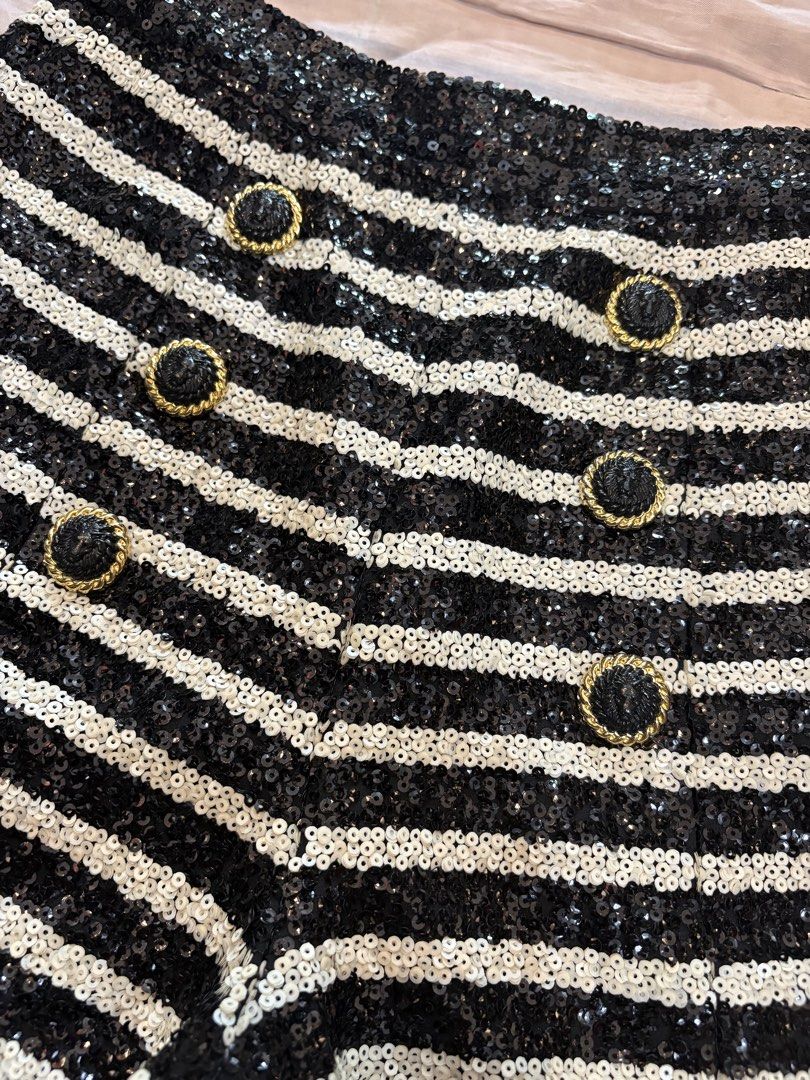 Balmain (Category: Luxury Apparel) located in Echague. Submitted by jake_rc (Listing ID 1454100811, Image 3). Description: Balmain black and white sequin-embellished horizontal striped shorts featuring signature gold-tone decorative buttons. Size 36 on tag Excellent condition Dimensions: Waist 27 Length 15.5 Hem 12 Rise 14 Price 4,800 plus SF.
