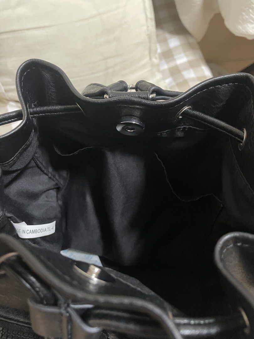 Black leather small backpack From GU JAPAN (Category: Backpacks) located in Rizal. Submitted by eunnie.shop83 (Listing ID 1454006050, Image 3). Description: - Black drawstring backpack - Made from durable faux leather - Two front pockets with secure zippers - Main compartment closes with a drawstring - Ideal for everyday essentials and travel needs - Spacious interior for your belongings.