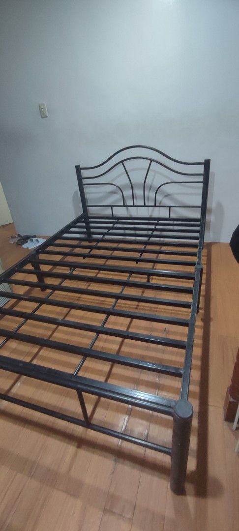 Black Metal Bed Frame with Headboard (Category: Bed Frames & Mattresses) located in Manila. Submitted by thea.magz (Listing ID 1454038618, Image 3). Description: - Dimension: 54×75 - Sleek black metal bed frame - Modern design with a curved headboard - Sturdy and provides excellent support - Easy to assemble - Mattress not included - Lightly Used it just stuck for a long time with flaws * first and second photo for visualization only Shipping/Pic
