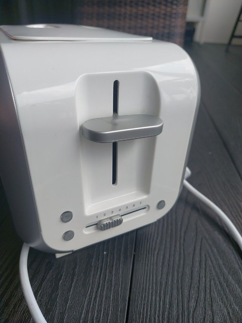 Bread Toaster (Category: Ovens & Toasters) located in Singapore. Submitted by precious_thought (Listing ID 1454041571, Image 2). Description: - Electrolux toaster - Stylish white and silver design - Adjustable browning control for perfect toast - Good working condition - Self collect .