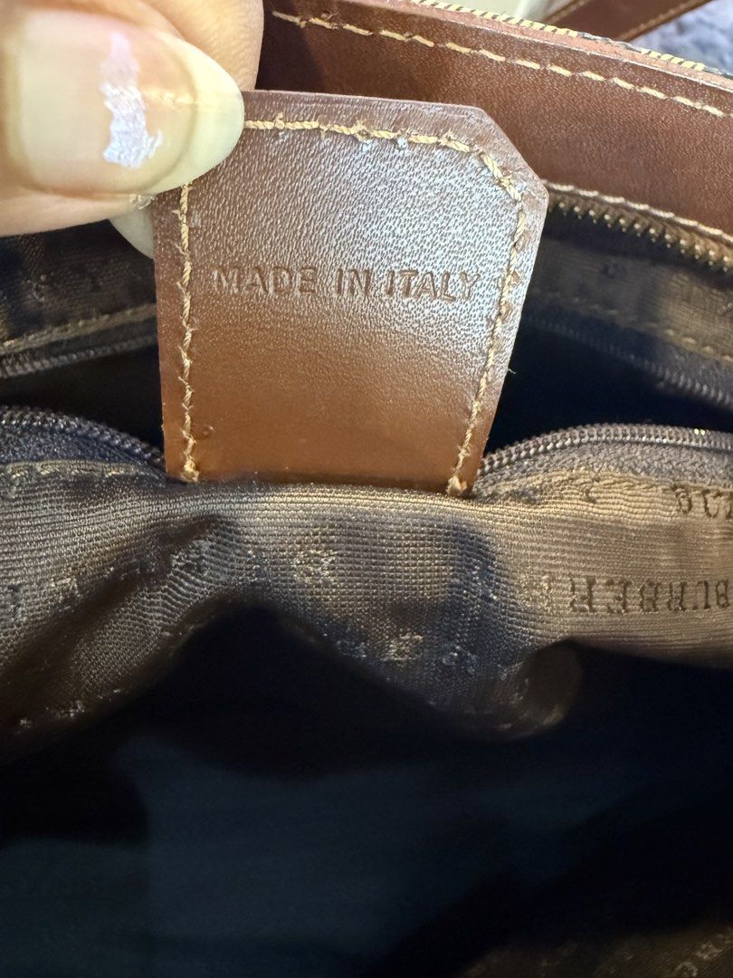 Burberry (Category: Tote Bags) located in Manila. Submitted by source.selection (Listing ID 1454058997, Image 3). Description: This Burberry tote features the brand's classic Haymarket check pattern overlaid with the signature equestrian knight logo..