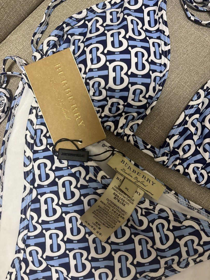 Burberry Monogram Bikini XL Blue White (Category: Bikinis & Swimsuits) located in Paranaque City. Submitted by jujudeclutterss (Listing ID 1454104672, Image 2). Description: - Burberry bikini set - Iconic blue and white monogram print - Halter neck top with adjustable tie straps - Matching tie-side bottoms - Size: XL - Condition: New with original tags attached - Made in Turkey.