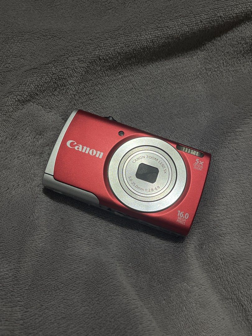 CANON POWERSHOT A2500 HD GOOD CONDITION (Category: Cameras) located in Manila. Submitted by ninib33 (Listing ID 1454120894, Image 1). Description: NO HIDDEN ISSUES!! CONDITION: 10/10!! NO SCRATCHES FULLY FUNCTIONAL - Red Canon Digital Camera - 16.0 Megapixels for clear shots - 5x Optical Zoom to get closer - Great for casual everyday photography - Easy to use, point-and-shoot functionality - Battery and card compartment located at the bottom come