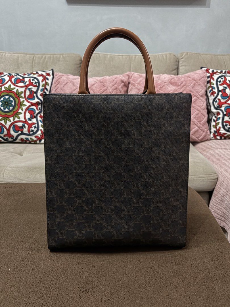 Authentic Celine Triomphe Canvas Vertical Cabas Tote Bag (Small) (Category: Luxury Bags & Wallets) located in Pasig City. Submitted by pat.soriano (Listing ID 1454093063, Image 3). Description: I’m selling my authentic Celine Triomphe Canvas Vertical Cabas Tote Bag in Small size. Bought last 2022 from the Celine Singapore boutique. Its a discontinued bag design. Its original price was around ₱100,000. This also has Entrupy authentication issued l