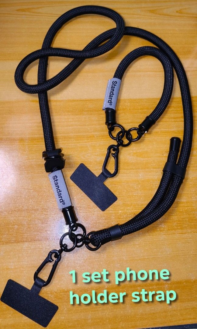 CELLPHONE HOLDER STRAP set (Category: Mounts & Holders) located in Rizal. Submitted by baltiq (Listing ID 1454179943, Image 1). Description: 2pc. Cellphone holder strap, all black 👉thick & durable cp holder. everyday carry, great travel buddy! 📌Auth. Standard brand from Japan 📌includes 2 pcs. cp holder straps(see pics) 📌very thick straps 0.39in./10mm., adjustable 📌all black hardwares; includes holder/hook for purse, shades/eyeglasses 💰MOP: 