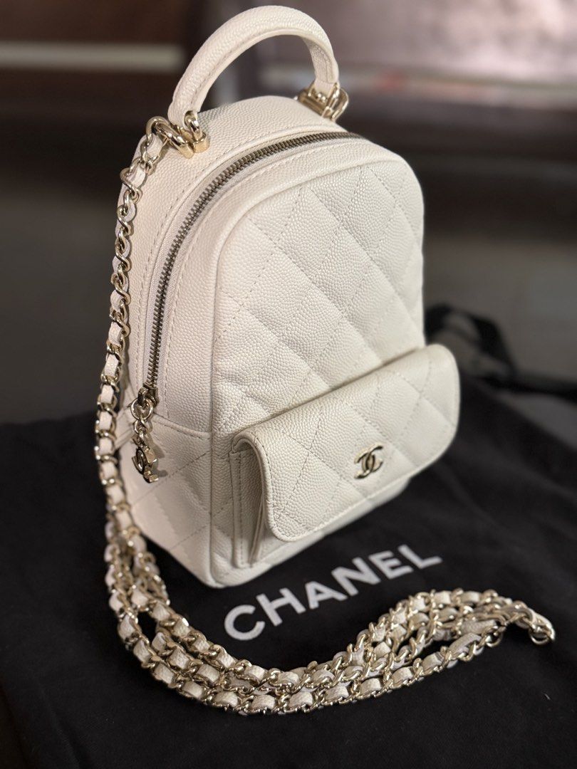 Chanel White Quilted Caviar Leather Mini Backpack (Category: Luxury Bags & Wallets) located in Quezon City. Submitted by anikalaine (Listing ID 1454031116, Image 2). Description: Chanel Mini Backpack Thrifted in Seoul, will pass new - Material: Black Caviar Leather - Hardware: Gold Chain Straps - Features: Quilted pattern, front pocket with iconic CC logo, top handle - Includes: dust bag North Susana QC Bank transfer.