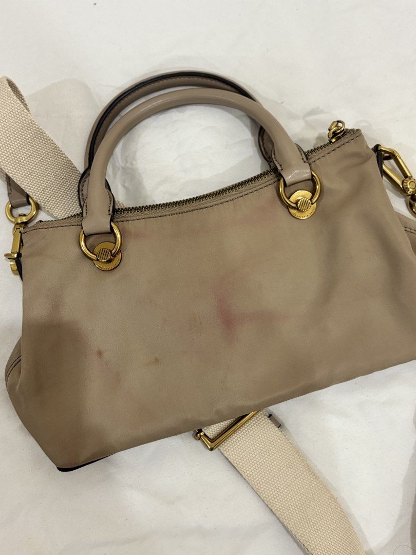 Charles & Keith Taupe Nylon Top Handle Bag with Strap (Category: Shoulder Bags) located in Marikina City. Submitted by beadc (Listing ID 1454160150, Image 3). Description: - Brand: Charles & Keith - Color: Taupe - Material: Nylon - Features: Top handles, detachable crossbody strap - Hardware: Gold details - Closure: Zip - Condition: Minor pink marks on the front (as pictured) - Ideal for: Everyday use.