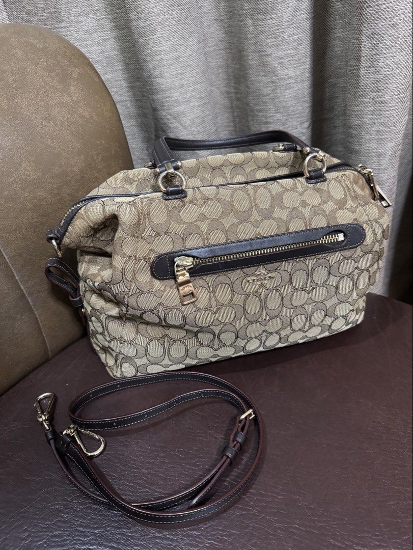 Coach Prairie Monogram Canvas Satchel Bag with Strap (Category: Luxury Bags & Wallets) located in Cavite. Submitted by __goodbyestuff (Listing ID 1454134919, Image 1). Description: - Signature jacquard - Inside zip pocket - Zip-top closure, fabric lining - Handles with 5” drop - Outside zip pocket - Detachable strap with 21” drop for shoulder or crossbody wear - 13 1/2” (L) x 8 3/4” (H) x 3 3/4” (W) - no longer with dustbag - used only twice sinc