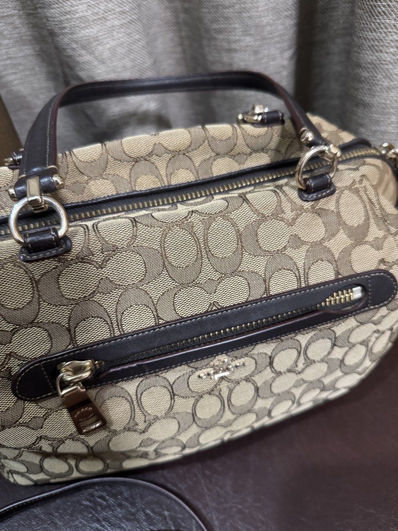 Coach Prairie Monogram Canvas Satchel Bag with Strap (Category: Luxury Bags & Wallets) located in Cavite. Submitted by __goodbyestuff (Listing ID 1454134919, Image 3). Description: - Signature jacquard - Inside zip pocket - Zip-top closure, fabric lining - Handles with 5” drop - Outside zip pocket - Detachable strap with 21” drop for shoulder or crossbody wear - 13 1/2” (L) x 8 3/4” (H) x 3 3/4” (W) - no longer with dustbag - used only twice sinc