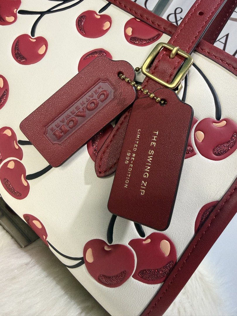 Coach Swing Zip - Cherry Print (Category: Luxury Bags & Wallets) located in Quezon City. Submitted by chicandcarry.ph (Listing ID 1454073960, Image 3). Description: ✨Brandnew 💯 Original Coach Bag 🤎Inclusion: Complete with tag, cc, poly & dustbag 📩PM for more details.
