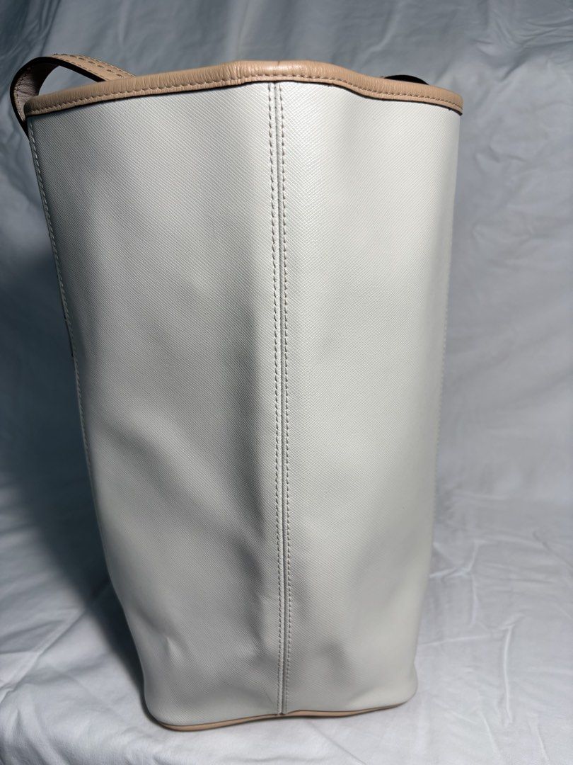 COACH TOTE BAG (Category: Luxury Bags & Wallets) located in Taguig. Submitted by vittelina (Listing ID 1454036612, Image 3). Description: -Color Block design Taupe center Cream side Panels and Beige trim -no discoloration on the body of the bag. Some scratches at the top and bottom sides of the bag. Still very nice and presentable looking, clean. A bit of stain mark at the interior. Can send pics upon request -Bought at Coach Outlet -100% Genuine