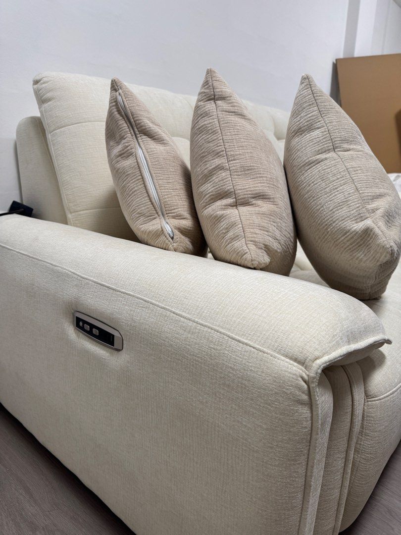 Sofa (Category: Sofas) located in Singapore. Submitted by Sceptics (Listing ID 1454034204, Image 2). Description: - Cream coloured sofa -reason for selling my living space too small for this - Tufted back cushions - Includes 3 throw pillows - Electric reclining function with remote control - UK type power plug - Ideal for home relaxation.