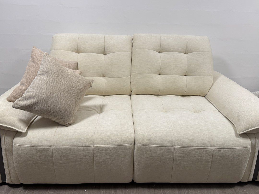 Sofa (Category: Sofas) located in Singapore. Submitted by Sceptics (Listing ID 1454034204, Image 1). Description: - Cream coloured sofa -reason for selling my living space too small for this - Tufted back cushions - Includes 3 throw pillows - Electric reclining function with remote control - UK type power plug - Ideal for home relaxation.