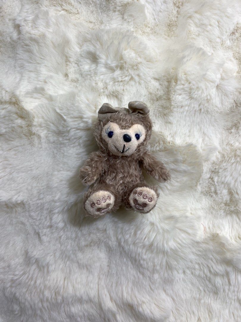 Duffy & Friends “Shelliemay” Bear Plush charm/ keychain (Category: Plushies & Soft Toys) located in Kalibo. Submitted by ollie_stuffshop (Listing ID 1454028512, Image 1). Description: Before you send your inquiries: ❗️Last Price is already posted ❗️Manage your expectations, WYSIWYG ❗️May need washing ❗️Shipping day is every Sunday - Adorable small brown plush bear - Sitting pose - Features charming blue eyes - Embroidered paw pads for a special t
