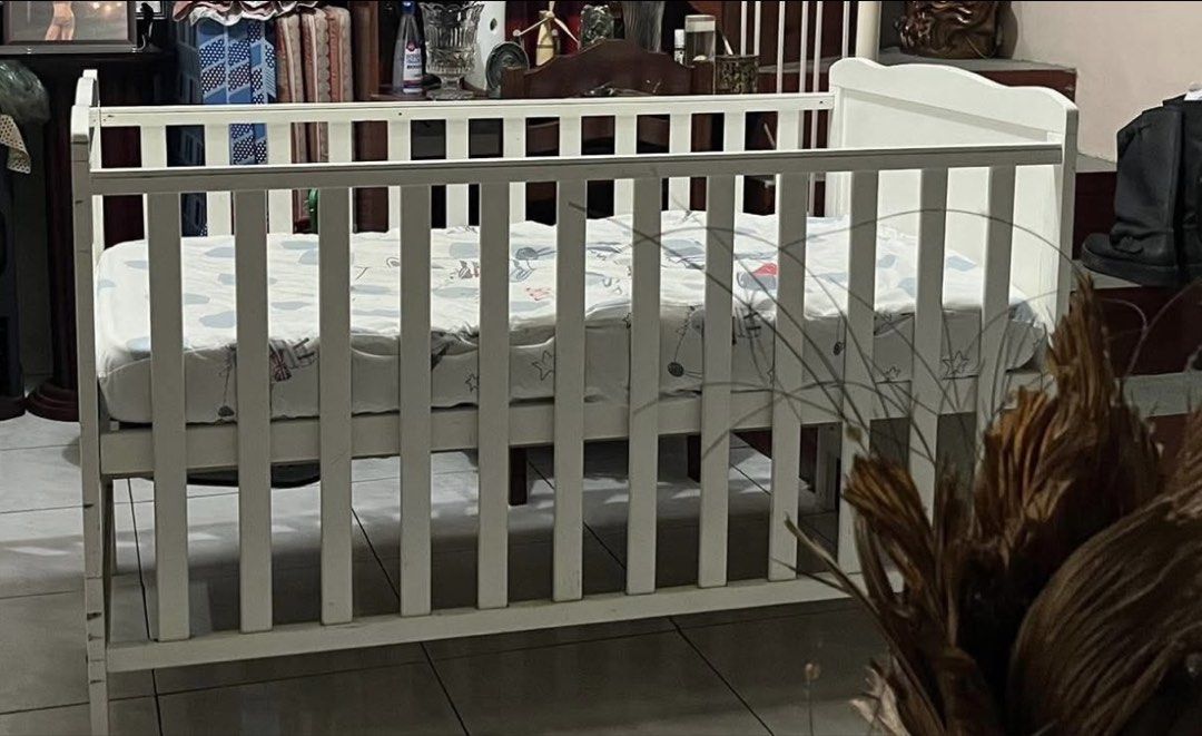 Dwelling Baby Crib (Category: Cots & Cribs) located in Bulacan. Submitted by unkn0wned1 (Listing ID 1454124213, Image 2). Description: for sale crib only sm dwelling baby crib -28x52 -adjustable to 3 heights -convertible to toddler bed very good used condition with some pencil scratches in the bed platform but can be covered by the foam (barely unnoticeable) orig mall price: 10k selling for 2400 with lp if sure buyer.