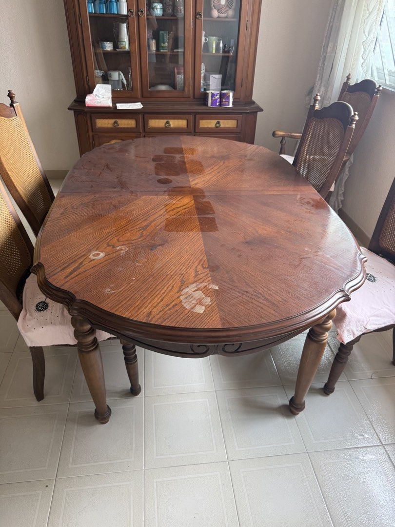 Extendable solid wood table (Category: Tables & Sets) located in Singapore. Submitted by i.am.a.genius (Listing ID 1454047065, Image 3). Description: Extendable from 1.68m to 2.14m 6 solid wood chairs with cushions. You will need to reupholster it yourself. Varnish the table to achieve the deep wood look at the centre. Dining chairs have rattan backing all in good condition. .