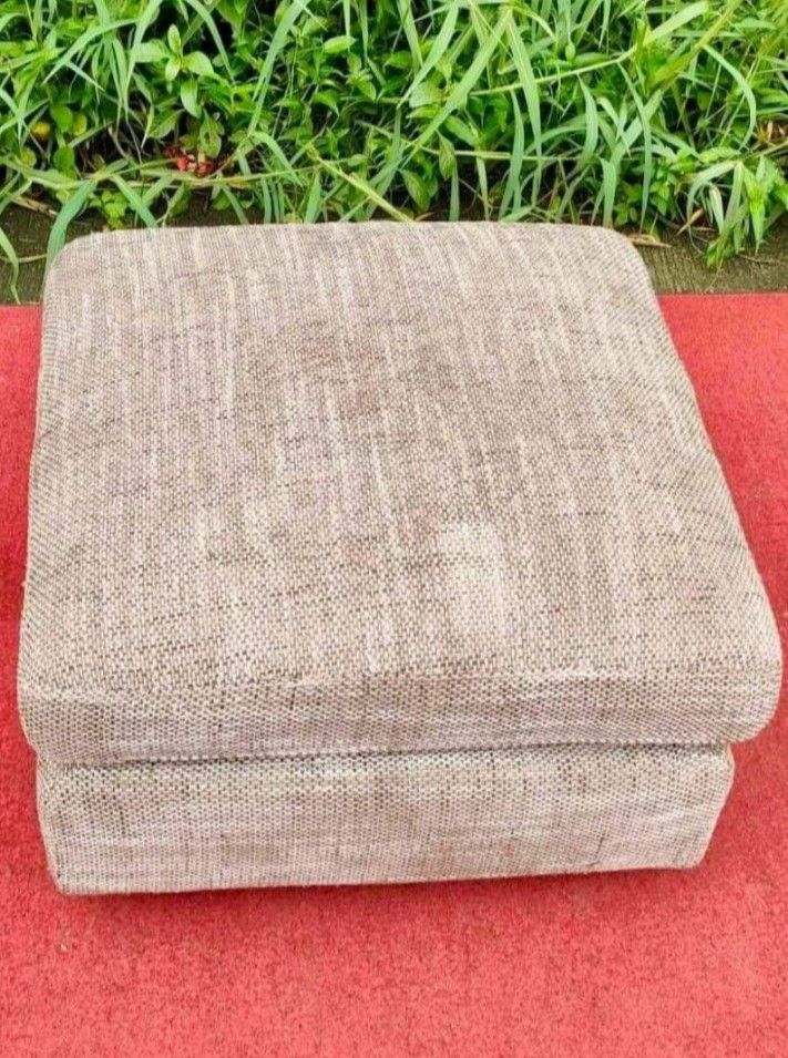 Fabric Ottoman Footrest Stool (Category: Chairs) located in Quezon City. Submitted by annienc (Listing ID 1454003323, Image 2). Description: - Square fabric ottoman in neutral beige/brown textured fabric - Adds comfort and versatility to any living space - Can be used as a footrest or extra seating. - Features sturdy wooden legs - Removable covers - Dimensions: 24 x 24 x 16 inches (LWH) .