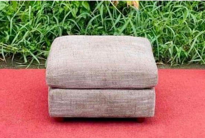 Fabric Ottoman Footrest Stool (Category: Chairs) located in Quezon City. Submitted by annienc (Listing ID 1454003323, Image 3). Description: - Square fabric ottoman in neutral beige/brown textured fabric - Adds comfort and versatility to any living space - Can be used as a footrest or extra seating. - Features sturdy wooden legs - Removable covers - Dimensions: 24 x 24 x 16 inches (LWH) .
