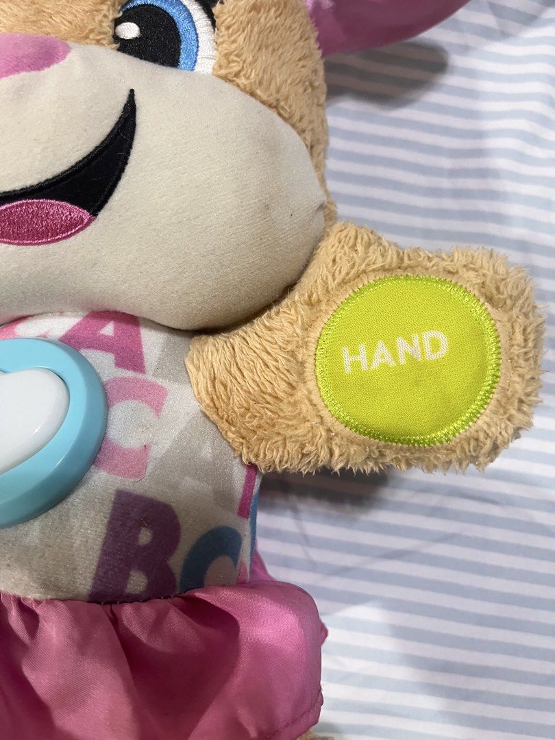 Fisher Price Smart and Learn Toy (Category: Infant Playtime) located in Quezon City. Submitted by babybutton2018 (Listing ID 1454004629, Image 2). Description: 📌The toy features over 100 first words and 75+ songs to teach babies and toddlers. 📌It includes interactive buttons on its paws and a light-up heart on its chest. 📌 Used but in good condition 📌Needs cleaning .