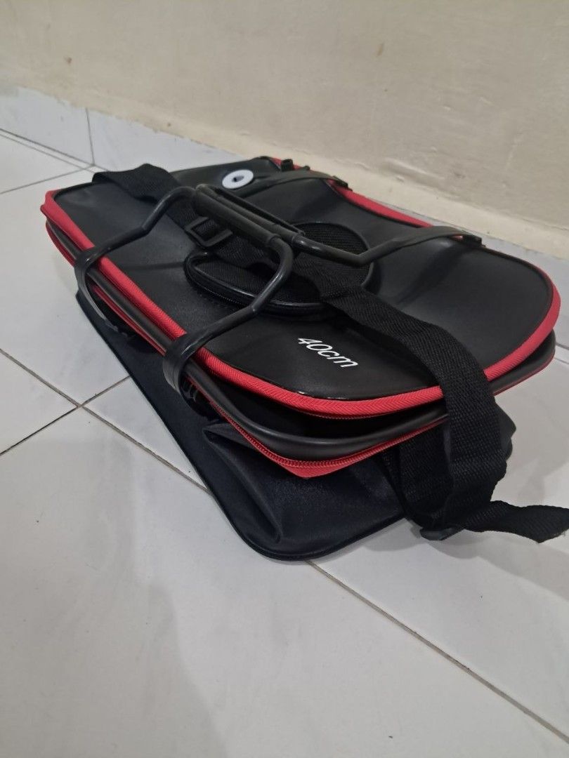 Fishing Bucket (Category: Fishing) located in Singapore. Submitted by excitedbabe (Listing ID 1454175708, Image 7). Description: - 40cm fishing bucket - Durable black and red design - Features a mesh opening for ventilation - Ideal for storing catch/live bait or fishing gear - Comfortable handle - Can put oxygen pump at the side, got hole for tube - 40 × 24 × 24 - 23 litres - Brand new, not used at all ☆ DM FOR FAST DEAL ☆.