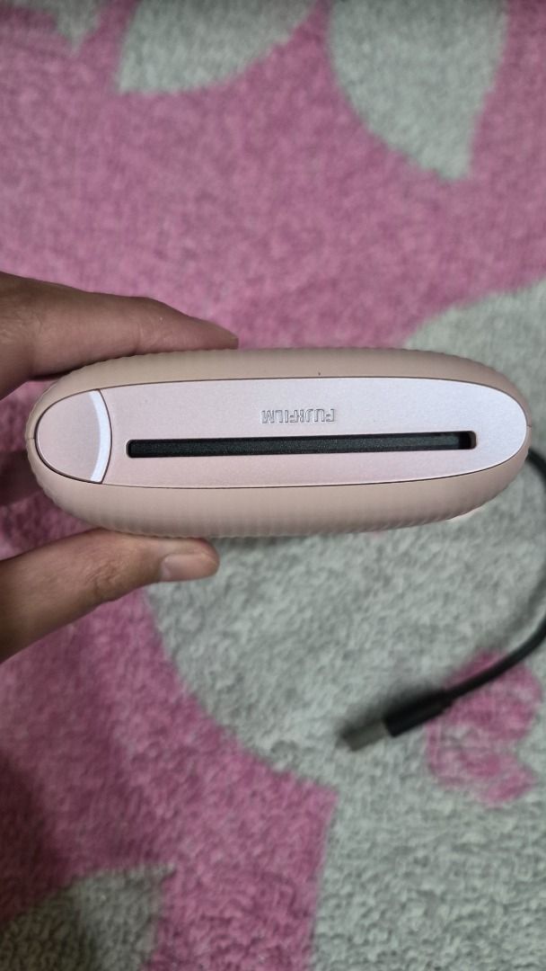 Fujifilm Instax Link Mini 2 (Category: Printers, Scanners & Copiers) located in Manila. Submitted by fastdragon_0c367e (Listing ID 1454053245, Image 3). Description: - Fujifilm Instax Link Mini 2 portable photo printer - Color: Pastel Pink - Sleek, compact, and portable design - Wirelessly prints photos from your smartphone - Easy to use and great for creating physical memories - Includes charging cable - Barely used, good as new.