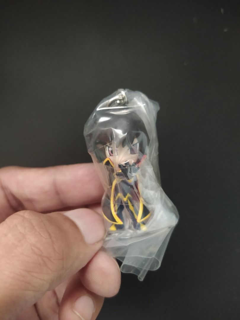 Gashapon - Code Geass Lelouch Lamperouge Chibi Keychain Bandai (Category: Figurines & Statues) located in Agdangan. Submitted by enzodeklutz (Listing ID 1454039157, Image 3). Description: - Authentic Code Geass Lelouch Lamperouge chibi keychain - From the official Bandai "Geass Swing" series - Features Lelouch in his iconic outfit - Packaging shows other characters like C.C. and Suzaku - Ideal for collectors or as a bag charm.