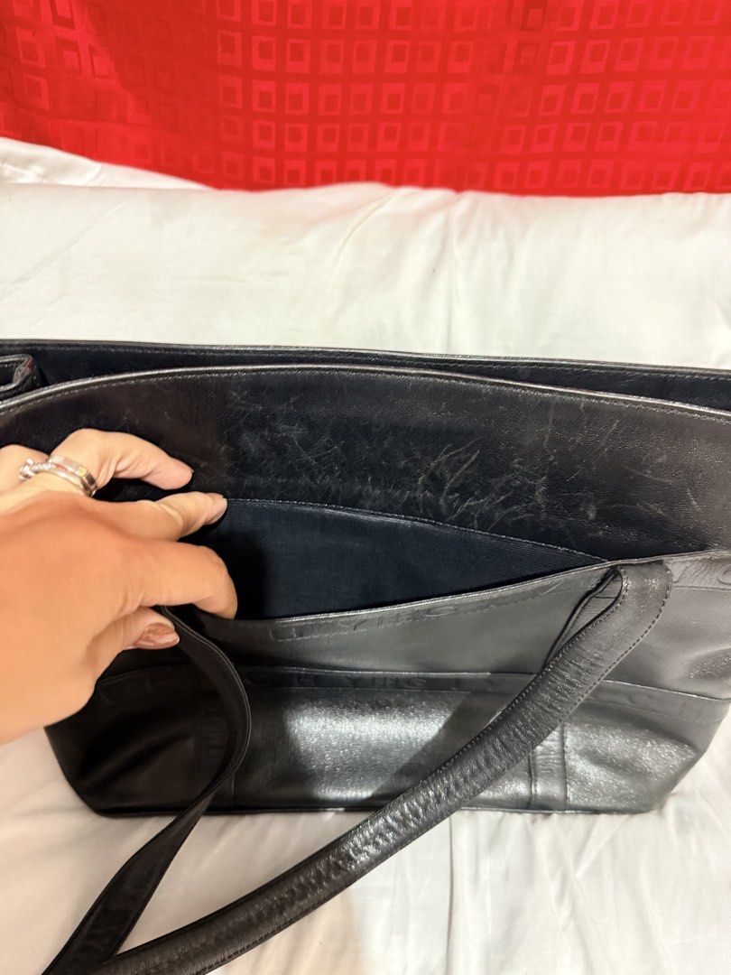 Givenchy Leather Tote Bag (Category: Luxury Bags & Wallets) located in Taguig. Submitted by myownstuff_mitch (Listing ID 1454144319, Image 3). Description: Authentic Givenchy Black Leather Tote bag Can be used as laptop bag or travel bag Rfs: need funds for medication.