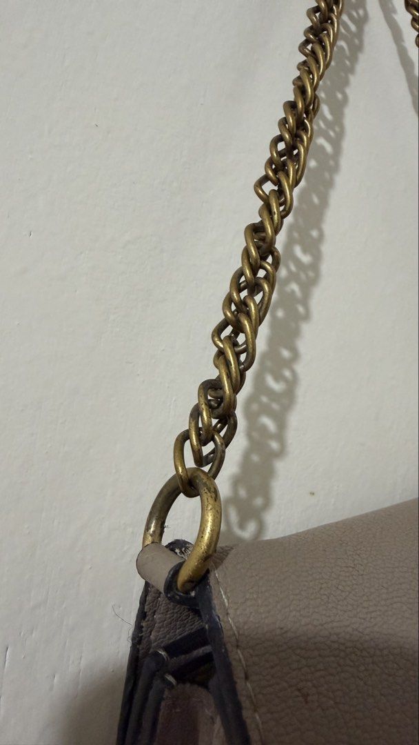 Givenchy Paris Taupe Leather Chain Shoulder Bag (Category: Luxury Bags & Wallets) located in Rizal. Submitted by lovegclothingph (Listing ID 1454135066, Image 3). Description: - Taupe leather and suede shoulder bag (Limited edition) - Iconic Givenchy logo clasp in antique gold - Size: Mini, but spacious - Antique gold chain strap - Structured design with multiple compartments - Versatile for day or night use - With signs of usage (Please see phot