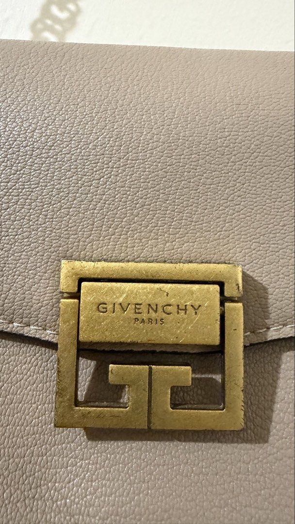 Givenchy Paris Taupe Leather Chain Shoulder Bag (Category: Luxury Bags & Wallets) located in Rizal. Submitted by lovegclothingph (Listing ID 1454135066, Image 2). Description: - Taupe leather and suede shoulder bag (Limited edition) - Iconic Givenchy logo clasp in antique gold - Size: Mini, but spacious - Antique gold chain strap - Structured design with multiple compartments - Versatile for day or night use - With signs of usage (Please see phot