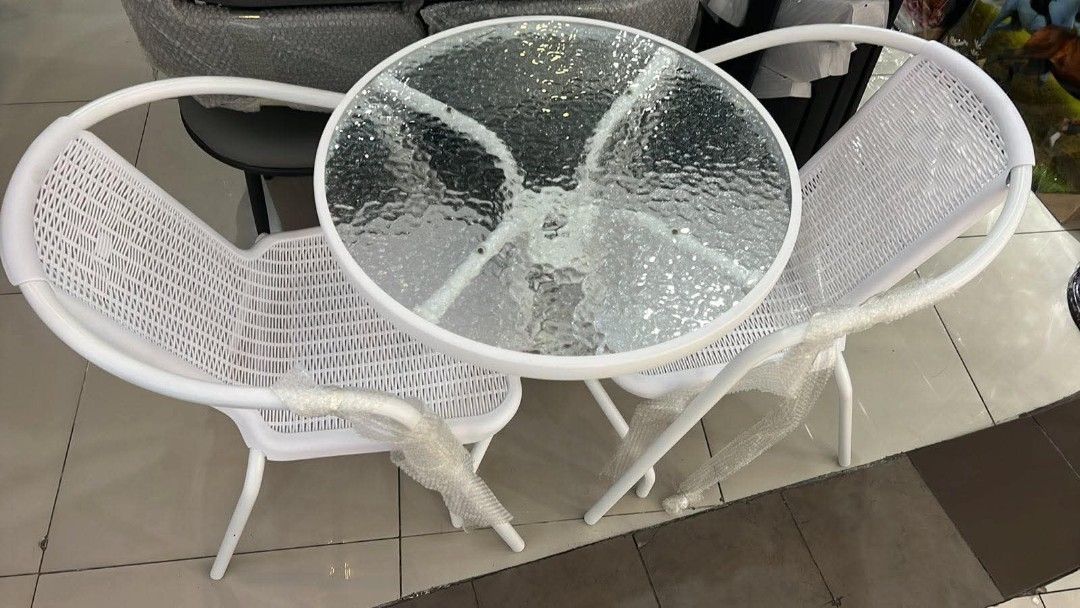 Glass Top Bistro Set with 2 Chairs (Category: Tables & Sets) located in Mandaluyong City. Submitted by carmy.94 (Listing ID 1454042912, Image 3). Description: - Round glass top table with textured pattern - Includes two modern metal chairs with slatted design - Perfect for small spaces like balconies or patios - Great for enjoying coffee or drinks outdoors - Easy to clean and maintain.