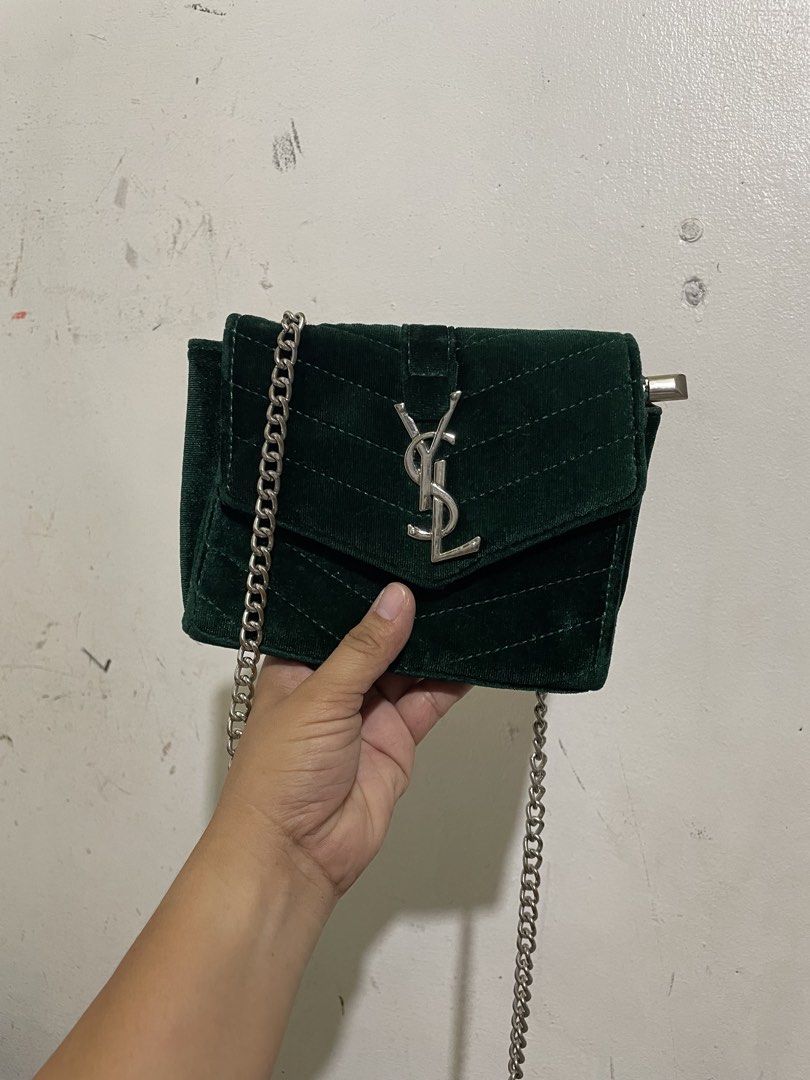 Green Velvet YSL Chain Bag (Category: Luxury Bags & Wallets) located in San Pedro. Submitted by ronamievsuazo (Listing ID 1454118884, Image 1). Description: - Dark green velvet crossbody bag - Iconic silver YSL logo hardware - Silver chain strap - Interior zippered compartment - Small and compact, ideal for nights out or adding a pop of color.