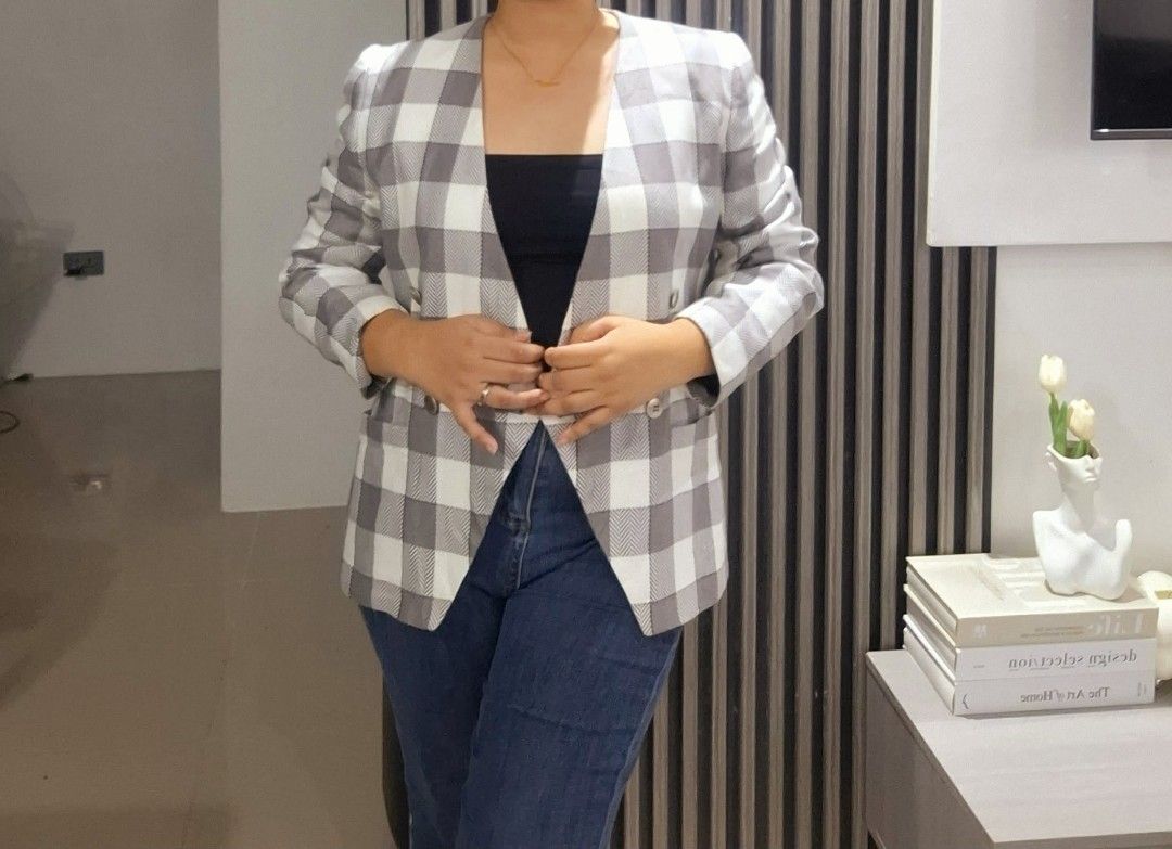 Grey and White Plaid Double-Breasted Blazer (Category: Coats, Jackets and Outerwear) located in Manila. Submitted by c.marga20 (Listing ID 1454173223, Image 2). Description: Classic grey and white plaid double-breasted blazer with notched lapels. Two buttons. Perfect for casual or semi-formal looks with jeans or trousers. Measurements: Bust: 39 inches Length: 25 inches Shoulder width: 17 inches Sleeve length: 22 inches Arm hole: 13 inches.
