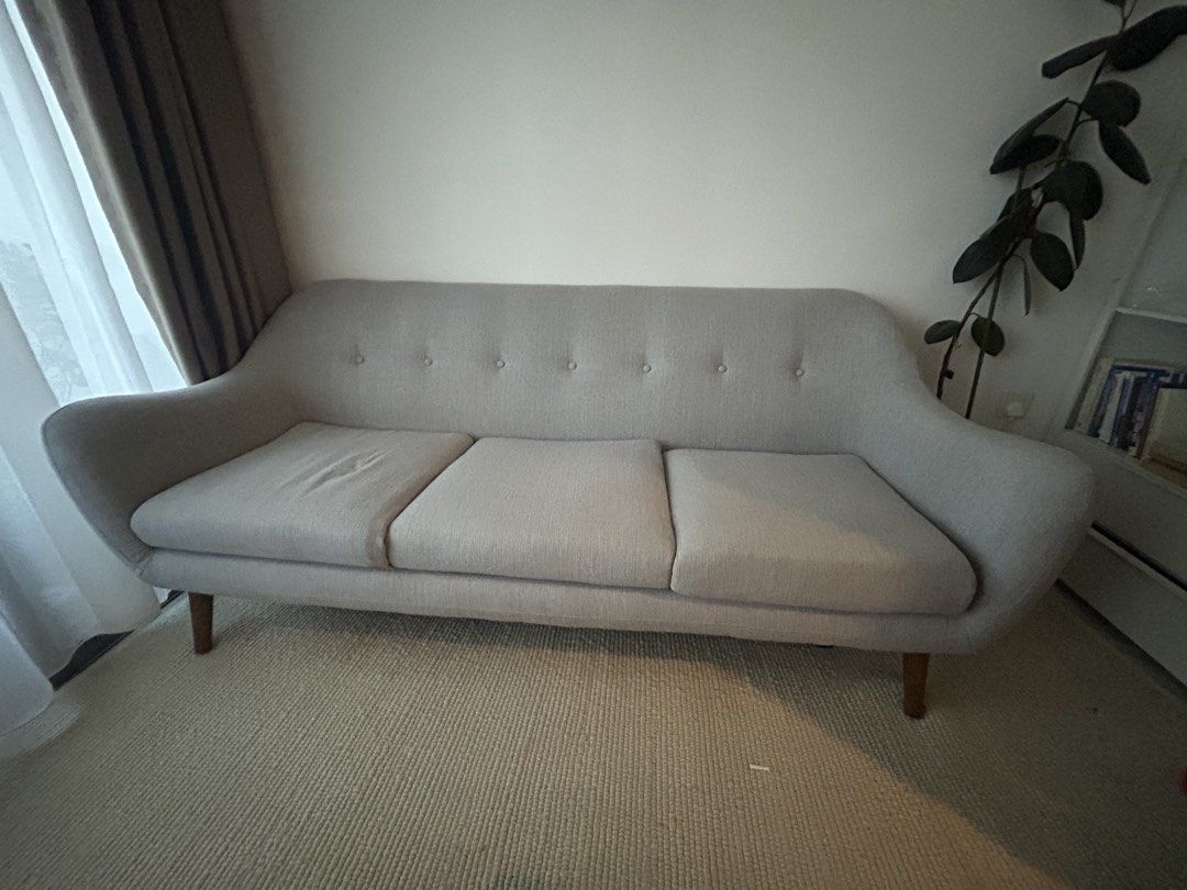Grey sofa (Category: Sofas) located in Singapore. Submitted by andiinic (Listing ID 1454028708, Image 3). Description: Compact, light grey couch. Dimensions 205cm x 80cm Good for smaller living rooms. Buyer to arrange pick up .