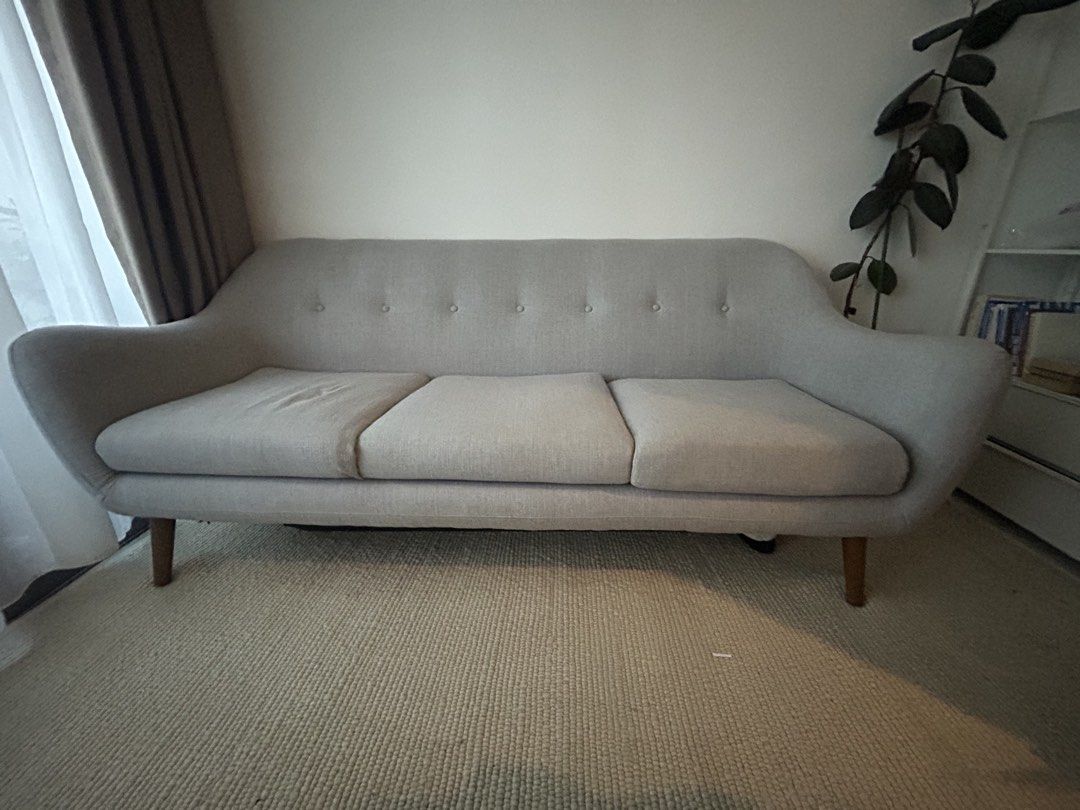 Grey sofa (Category: Sofas) located in Singapore. Submitted by andiinic (Listing ID 1454028708, Image 2). Description: Compact, light grey couch. Dimensions 205cm x 80cm Good for smaller living rooms. Buyer to arrange pick up .