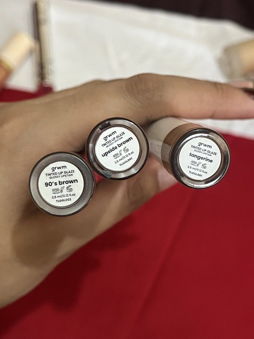 grwm tinted lip glaze (Category: Makeup) located in Manila. Submitted by orangeisloopy (Listing ID 1454085191, Image 2). Description: shades: 90s brown, upside brown, tangerine 60% full ₱120 each, ₱300 take all.