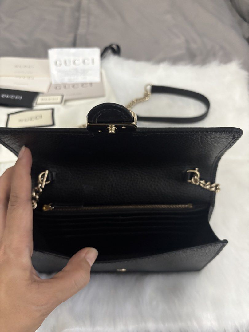 Gucci GG Interlocking Wallet on Chain bag (Category: Luxury Bags & Wallets) located in Marikina City. Submitted by chiya.s0821 (Listing ID 1454016949, Image 2). Description: - Authentic Gucci Wallet on Chain - Color: Black - Material: Pebbled Leather - Hardware: Gold GG Logo - Strap: Detachable Chain - Interior: Card Slots, Zip Pocket - Includes: Original Box, Dust Bag, Authenticity Cards - Versatile: Ideal for evenings or everyday use.