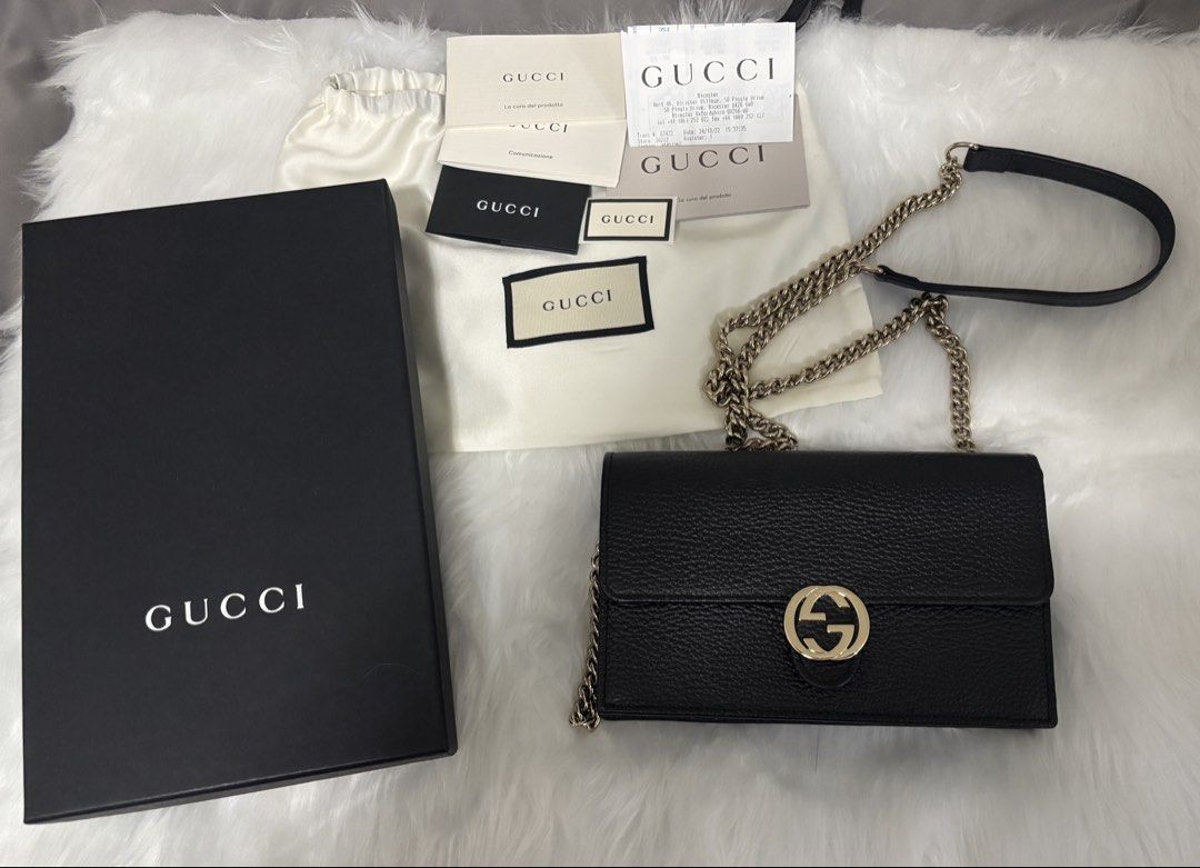 Gucci GG Interlocking Wallet on Chain bag (Category: Luxury Bags & Wallets) located in Marikina City. Submitted by chiya.s0821 (Listing ID 1454016949, Image 1). Description: - Authentic Gucci Wallet on Chain - Color: Black - Material: Pebbled Leather - Hardware: Gold GG Logo - Strap: Detachable Chain - Interior: Card Slots, Zip Pocket - Includes: Original Box, Dust Bag, Authenticity Cards - Versatile: Ideal for evenings or everyday use.