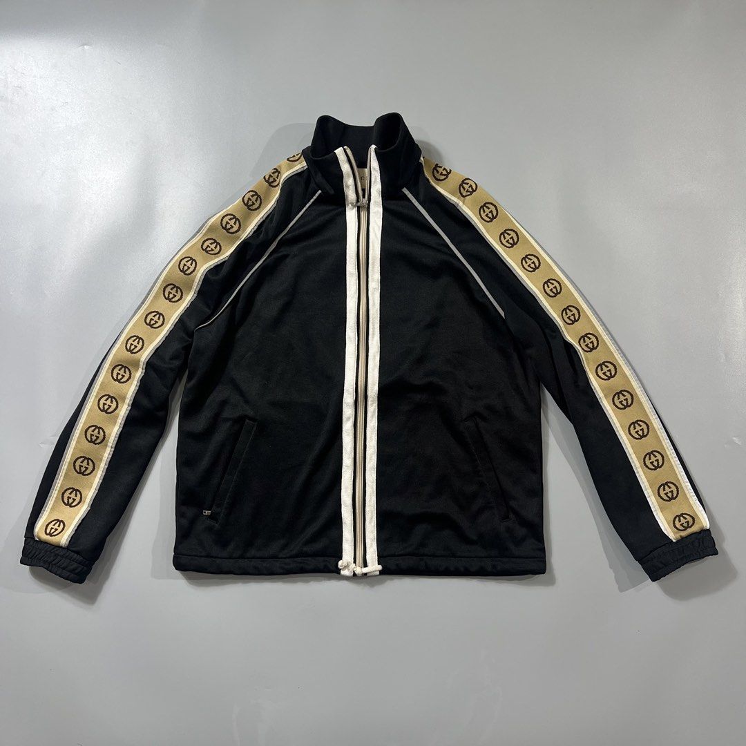 Gucci GG Track Jacket (Category: Coats, Jackets and Outerwear) located in Baguio. Submitted by pinkpixie (Listing ID 1454153876, Image 1). Description: - Iconic GG monogram stripe down the sleeves - Zip-up front with stand-up collar - Two side pockets with zippers - Made in Italy - Ideal for casual wear or athleisure.